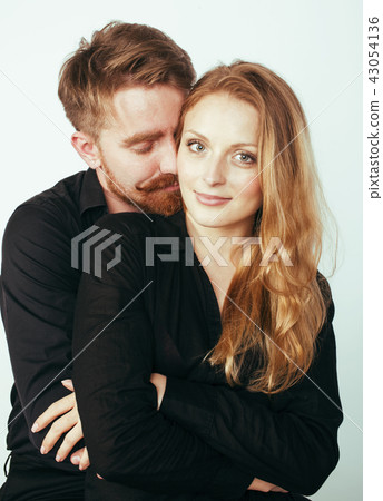 young pretty couple in love huggings isolated on white backgroun young pretty couple in love huggings isolated on white backgroun 43054136