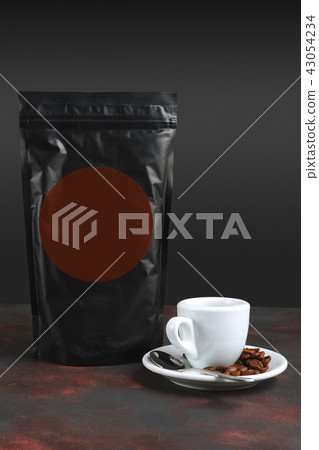 Cup of coffee and vacuum coffee package. Cup of coffee and vacuum coffee package. 43054234