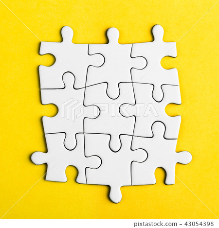 Connected blank puzzle pieces on a yellow background 43054398