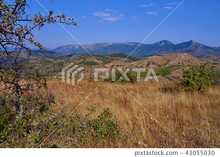 a panorama of rocky mountains and dry hills near t 43055030