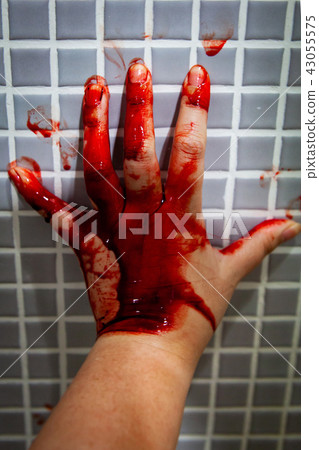 Hand of depressed woman covered with fresh blood 43055575