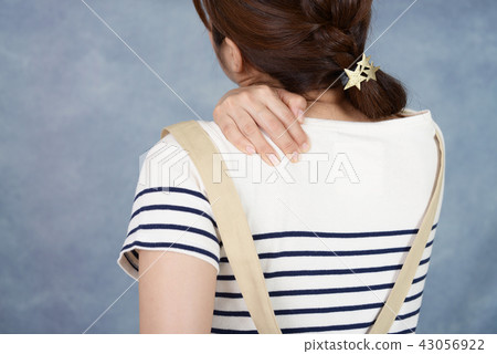Women complaining of stiff shoulders Women complaining of stiff shoulders 43056922