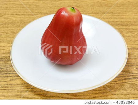 Fresh Red Water Apple on White Plate Fresh Red Water Apple on White Plate 43058046