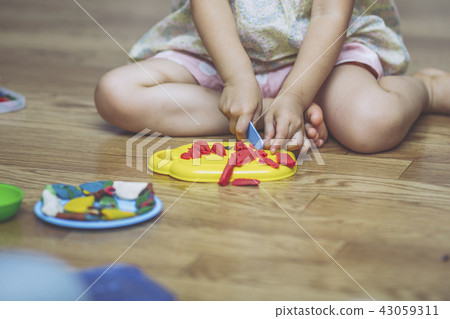 Child enjoying clay play 43059311