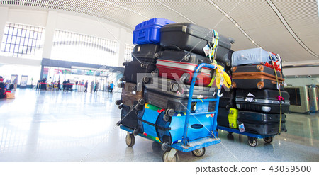 Many Colorful Luggage stack bags before loading 43059500