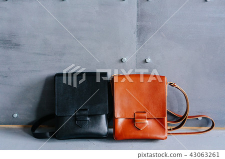 two leather bags on a gray background 43063261
