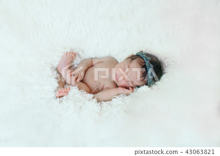 Portrait of newborn baby on a white background. Portrait of newborn baby on a white background. 43063821