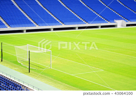 Scenery of a soccer stadium with beautiful green natural grass Scenery of a soccer stadium with beautiful green natural grass 43064100