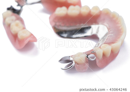Close-up metal removable partial denture on white  43064246
