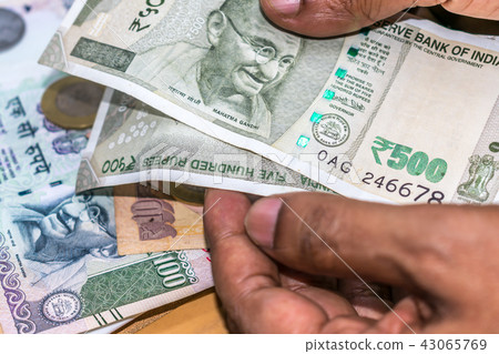 Counting Indian rupee currency,money Counting Indian rupee currency,money 43065769