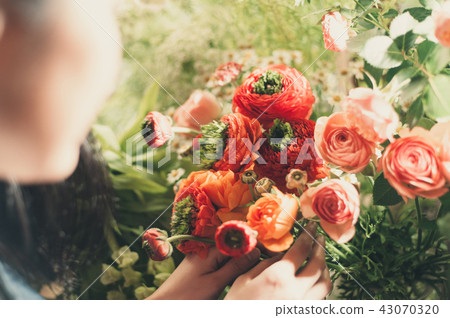 A woman in a flower shop A woman in a flower shop 43070320