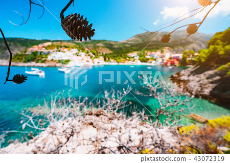 Beautiful Assos village, Kefalonia. Greece. White cruise yachts staying at anchor in beautiful 43072319