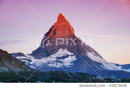Matterhorn peak during sunrise in the Switzerland 43073648