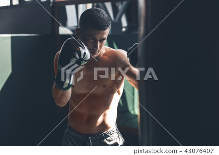 Topless man is boxing in sport club Topless man is boxing in sport club 43076407