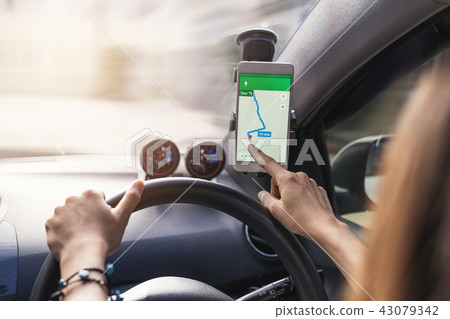 woman using gps navigation map on smartphone 43079342