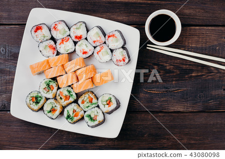 assortment of japanese sushi rolls on white plate 43080098