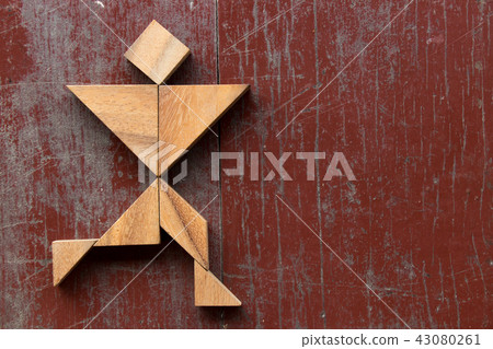 Tangram puzzle in joyful man running shape 43080261