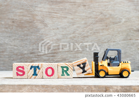 Toy forklift hold letter block y to word story Toy forklift hold letter block y to word story 43080665