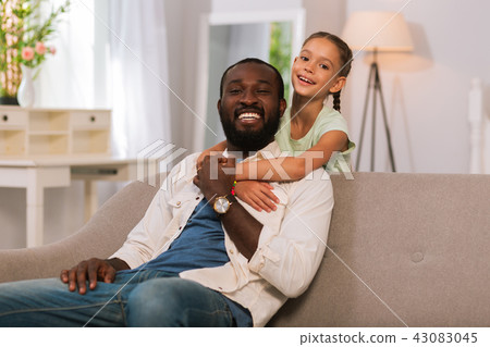 Happy cute girl hugging her father with love 43083045