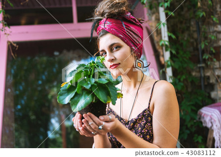 Beautiful blue-eyed woman taking care of environment 43083112