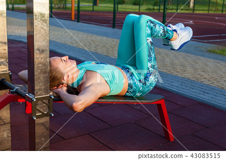 girl is engaged in fitness at the sports grounds 43083515