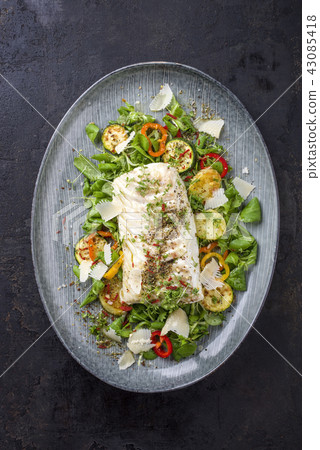 Fried cod fish fillet with lettuce and vegetable 43085418