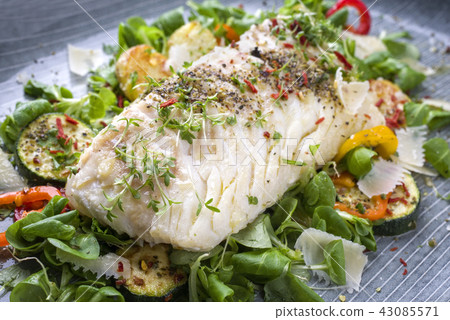 Fried cod fish fillet with spice and cress 43085571