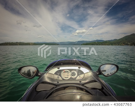 on a jet ski on a lake in the coeur d'alene city  43087763