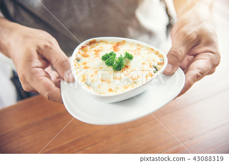 hand Chef suggesting exquisite appetizer Spinach hand Chef suggesting exquisite appetizer Spinach 43088319