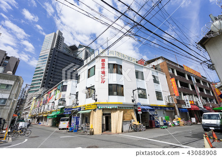 名古屋市中村区名駅柳橋中央市場名古屋綜合市場ビルマル中食品センタービルと名古屋駅前高層ビル群 照片素材 圖片 圖庫