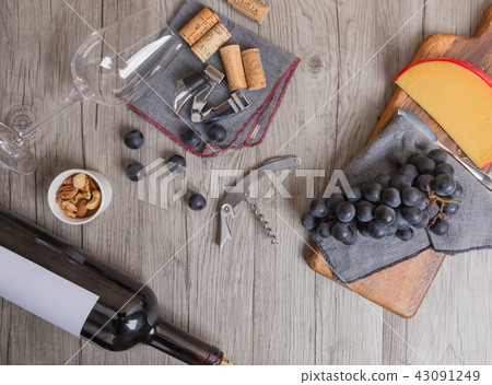 Wine bottles and cheese and accessories 43091249