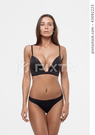 Perfect body young woman on a white background in sexy lingerie Perfect body young woman on a white background in sexy lingerie 43092223