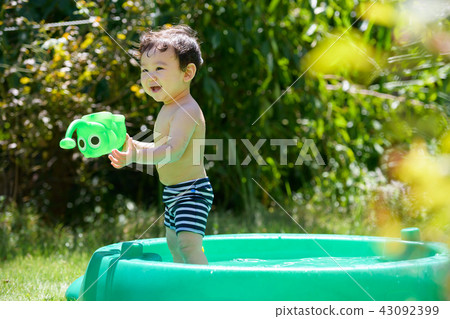 One year old boy playing in the water 43092399