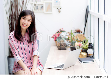 Beautiful portrait asian woman working on laptop 43095031