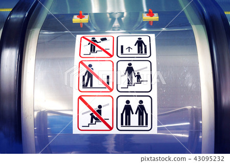 Warning signs on the escalator in the metro Warning signs on the escalator in the metro 43095232