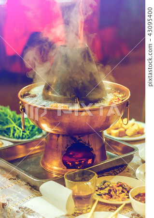 Asian double flavor hot pot on the table 43095400
