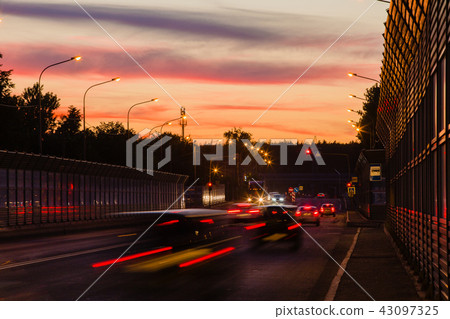 Summer landscape with highway and tracks from car headlights Summer landscape with highway and tracks from car headlights 43097325