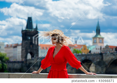 Beautiful girl in red dress travel in Prague Beautiful girl in red dress travel in Prague 43098871