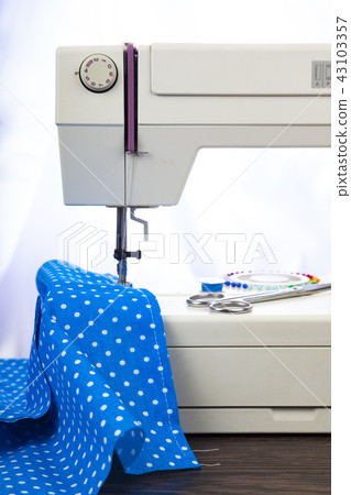 Sewing machine and blue fabric Sewing machine and blue fabric 43103357