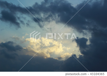 Dark and dramatic storm clouds on blue sky Dark and dramatic storm clouds on blue sky 43104365