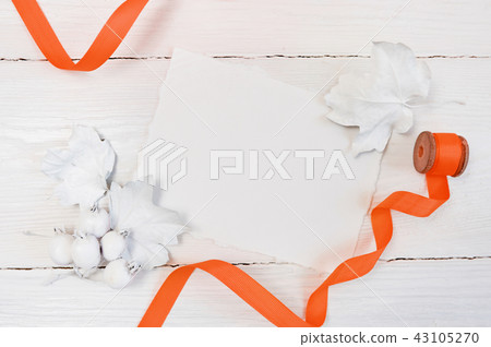 White berries, pumpkin, leaves and orange ribbon on a wooden mockup autumn background. Greeting card White berries, pumpkin, leaves and orange ribbon on a wooden mockup autumn background. Greeting card 43105270