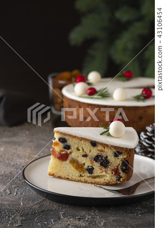 Christmas fruit cake, pudding on white plate. Copy space. Christmas fruit cake, pudding on white plate. Copy space. 43106454