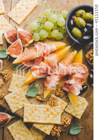 Mediterranian appetizers on old wooden table 43111558