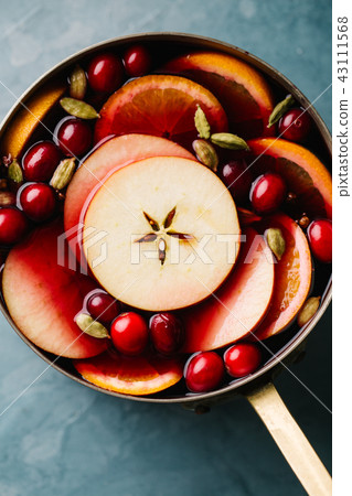 Mulled wine with fruits in saucepan 43111568