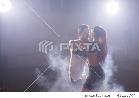 Active happy adults dancing bachata together in dance class Active happy adults dancing bachata together in dance class 43112744