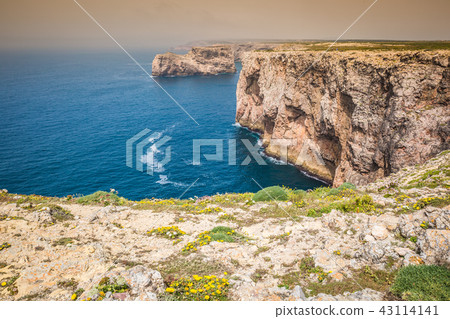 High cliffs and blue ocean at Cabo Sao Vicente High cliffs and blue ocean at Cabo Sao Vicente 43114141