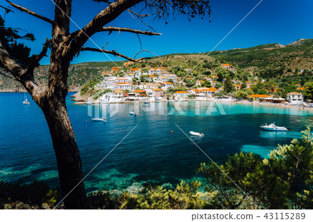 Assos village, Kefalonia Greece. View on turquoise transparent bay lagoon of Mediterranean sea Assos village, Kefalonia Greece. View on turquoise transparent bay lagoon of Mediterranean sea 43115289