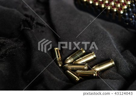 Full metal jacket 9mm ruger bullet on cloth 43124043