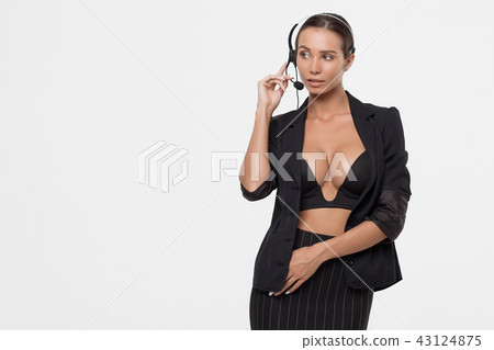 Lady with deep neckline and head microphone 43124875