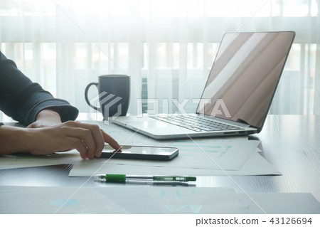 female using 0smartphone connection while working 43126694